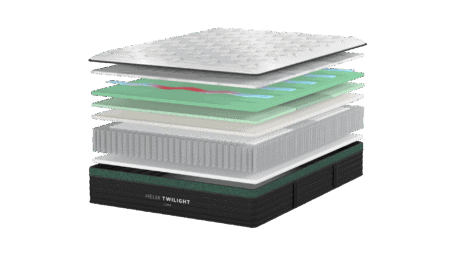 High-resolution layered mattress with memory foam, latex, pocket coils, and supportive base designed for optimal comfort and spinal alignment.